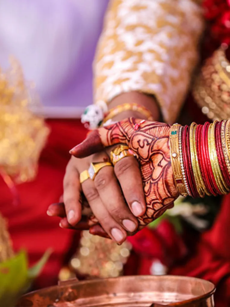 Bride and groom holding hands during wedding ceremony